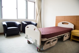 An empty hallway in a nursing home, representing the impact of facility closures on residents, emphasizing the need for estate planning and understanding elder law for resident protection and rights.