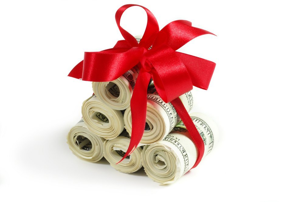 A stack of cash wrapped in a golden ribbon, symbolizing the importance of understanding gift tax implications in estate planning.