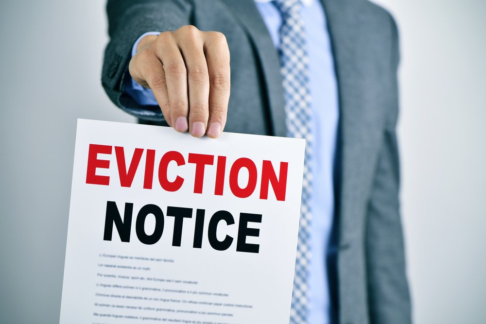 An eviction notice taped to the door of a nursing home, highlighting the crisis of Medicaid residents being displaced to make space for coronavirus patients who are more financially lucrative for facilities.
