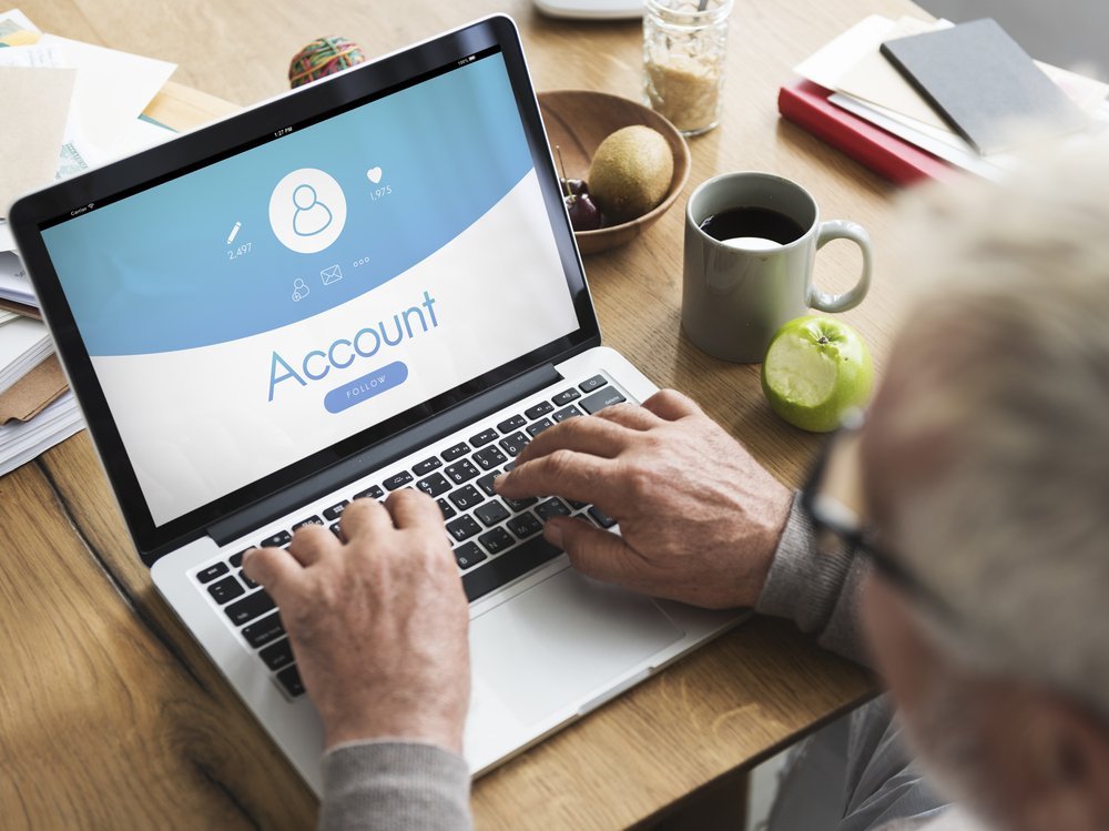 A laptop displaying financial graphs, symbolizing the importance of managing digital assets in estate planning and elder law to protect one's online legacy.