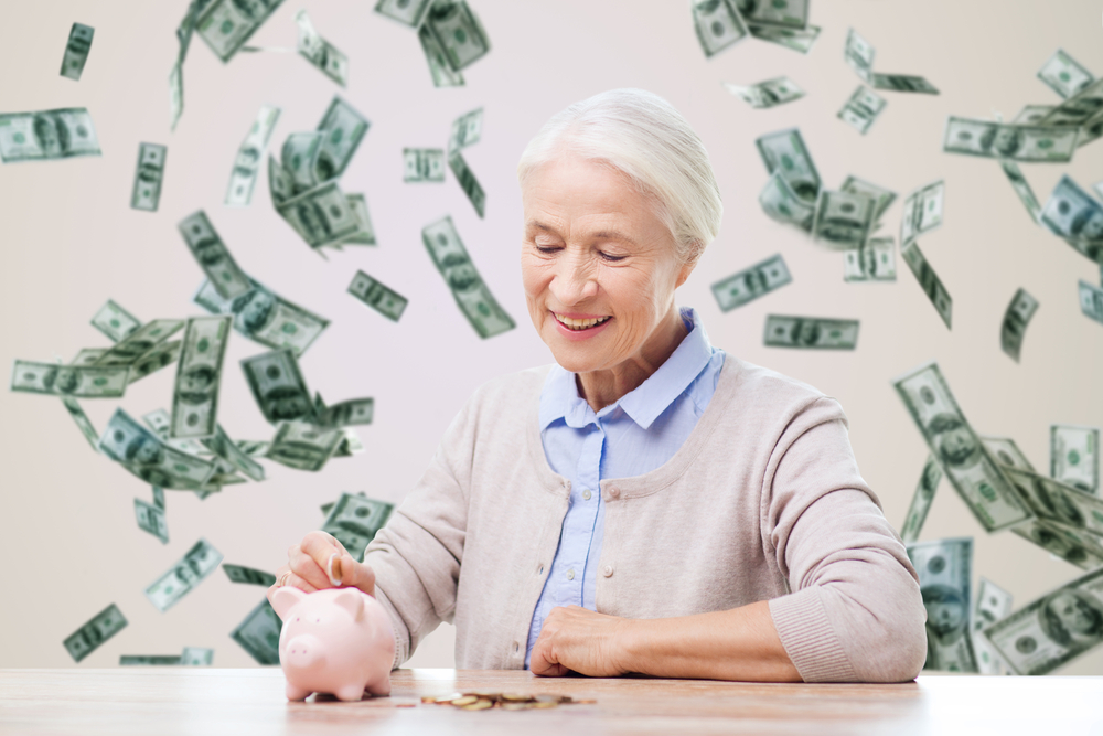 A senior couple reviewing financial documents at a table, symbolizing the importance of understanding Social Security benefits for retirement planning and estate management.