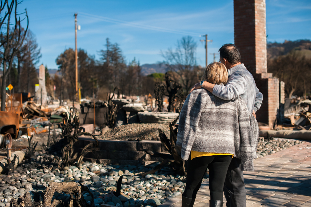 Fire-damaged home illustrating the importance of safeguarding estate planning documents from natural disasters.