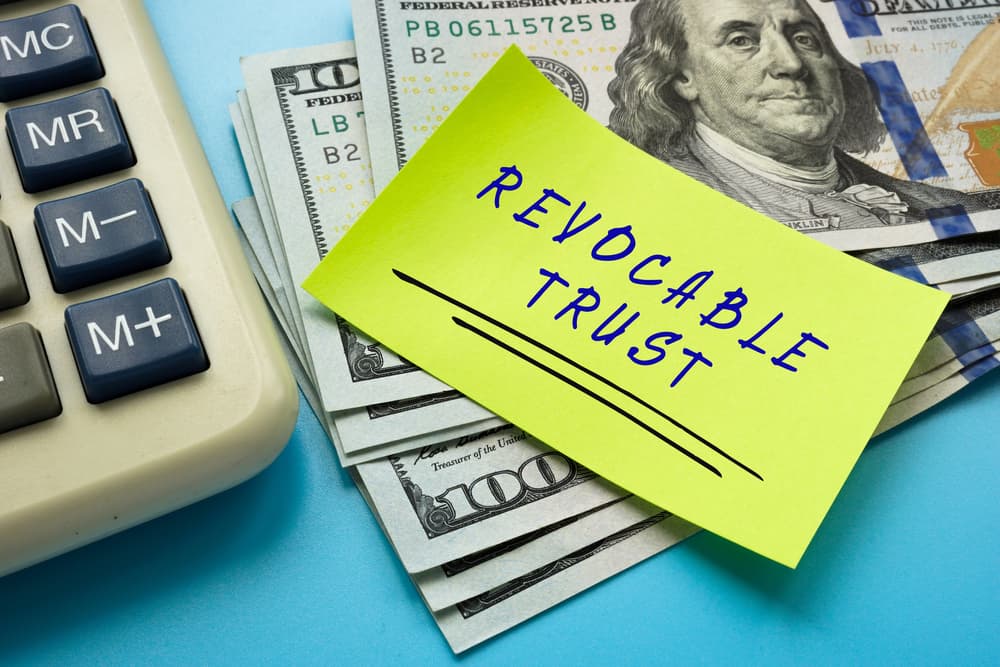 An image illustrating estate planning concepts with documents related to a revocable trust and power of attorney, highlighting their role in elder law and financial security.