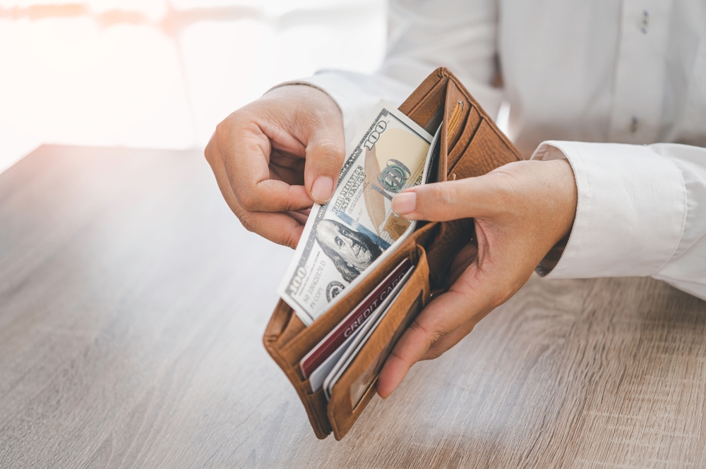 Image of a wallet filled with money, symbolizing financial recovery and estate planning implications following a Supreme Court ruling on Medicaid recoupment from personal injury settlements.