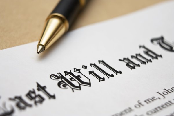 Close-up of a last will and testament document with a pen laying on top, symbolizing estate planning and legal measures to prevent will contests.