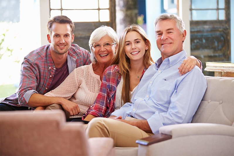 A concerned older couple discusses estate planning and property management with a financial advisor, emphasizing the importance of legal considerations when children become adults.