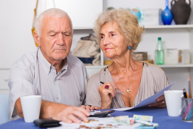 Image depicting a person making notes or changes to a will, representing the process of updating estate planning documents, with a focus on how to change a will in New Jersey.