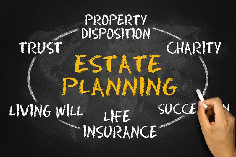 A person reviewing estate planning documents at a desk, emphasizing the importance of timely and comprehensive estate planning beyond just a will.