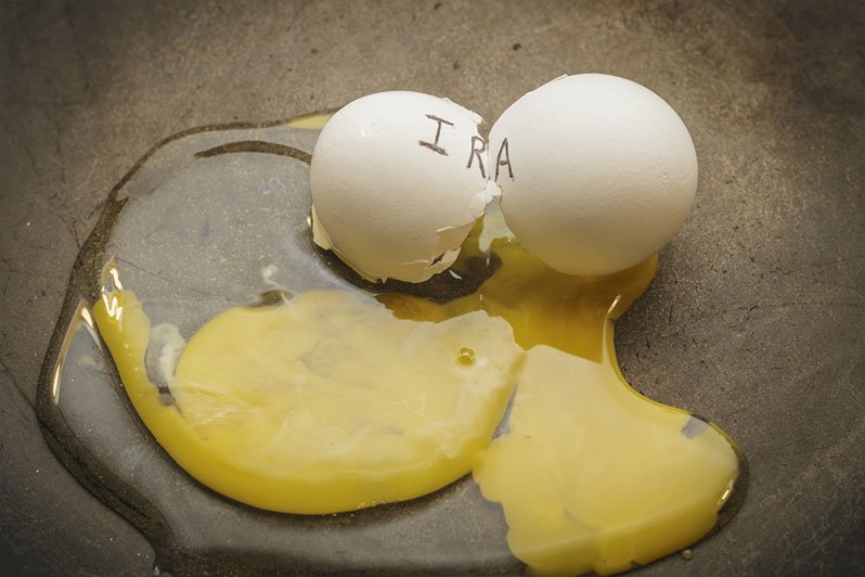 A cracked golden egg on a dark background symbolizing the vulnerability of retirement accounts to creditors, emphasizing the importance of estate planning and elder law to protect assets.