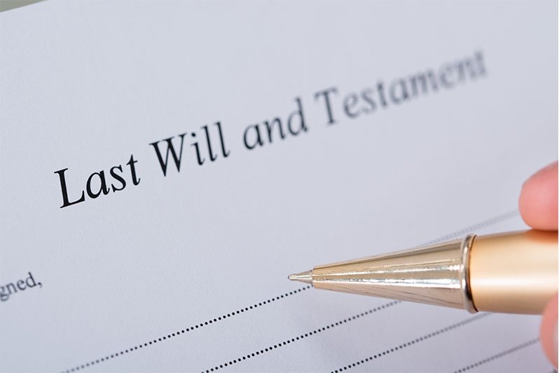 A last will and testament document with a pen, illustrating the importance of estate planning and understanding intestate succession when there is no will.