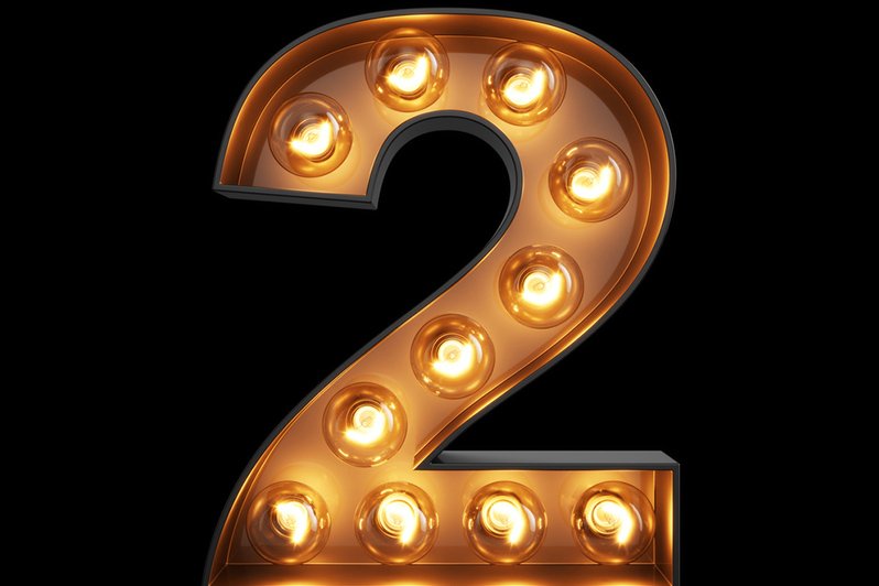 A person reviewing estate planning documents and beneficiary designations at a desk, emphasizing the importance of updating these details before the end of the year.