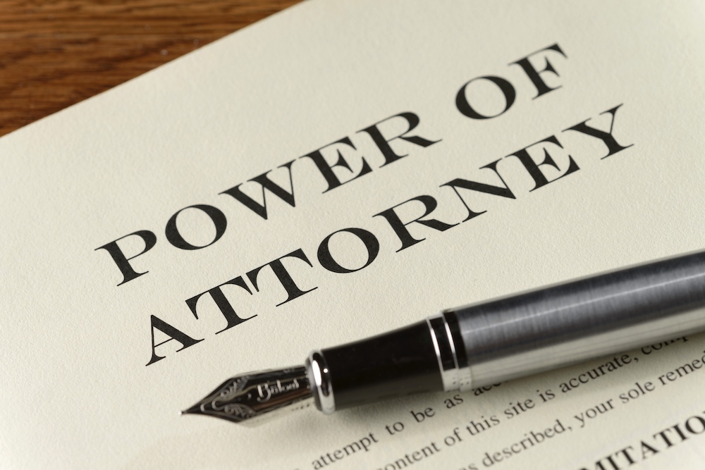 Image depicting important legal documents for understanding powers of attorney in estate planning and elder law contexts in New Jersey.