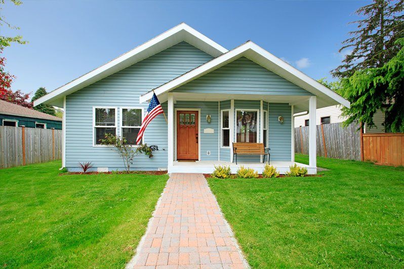 Small house symbolizing real estate investment involved in community property trusts as a strategy for estate planning and minimizing taxation.
