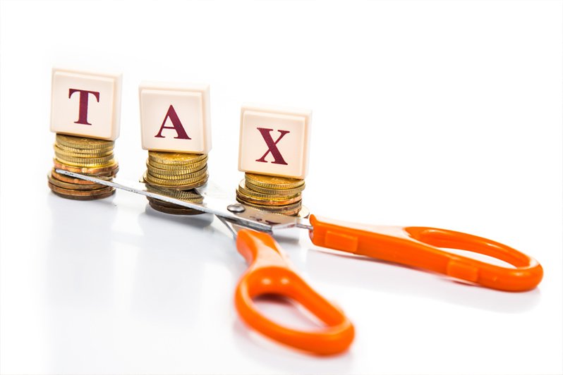 A conceptual image illustrating estate planning, featuring a tax cut visual which symbolizes minimizing federal estate taxes through strategic use of portability for married couples.