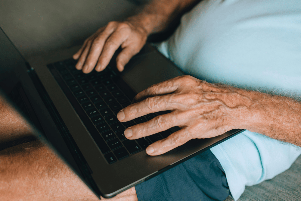Person using a laptop to create a DIY estate plan online