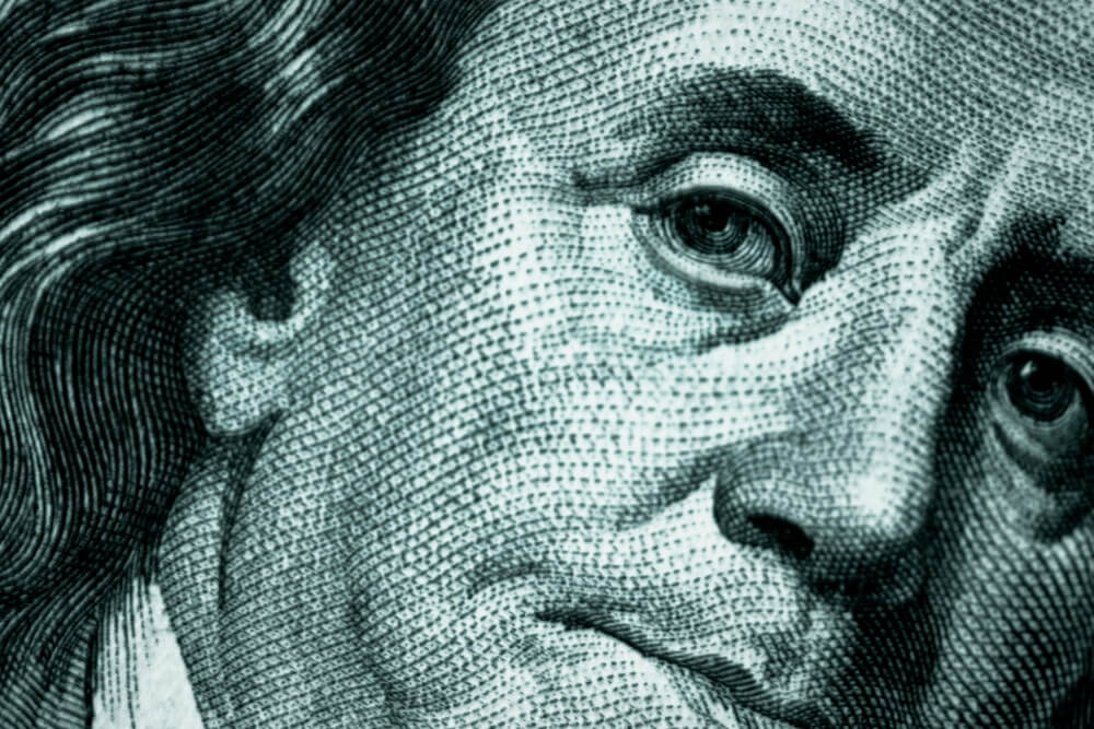 Close-up detail of U.S. currency representing debt, financial obligations, and estate planning considerations