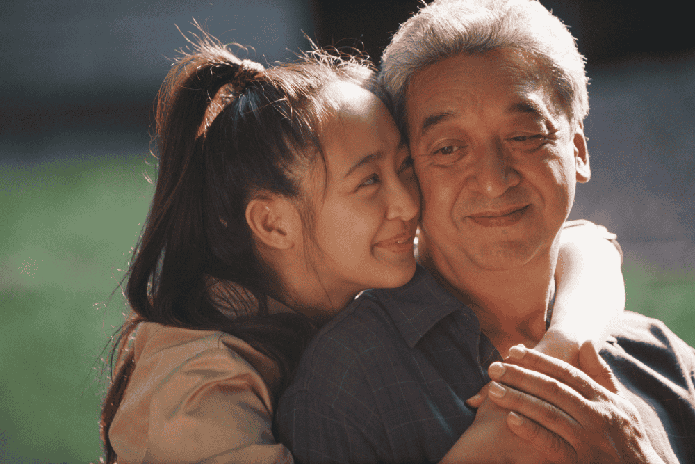 Father and adult daughter embracing, representing leaving an inheritance to children and protecting a family legacy through estate planning.